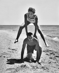 Young Couple Playing Leapfrog on the Beach